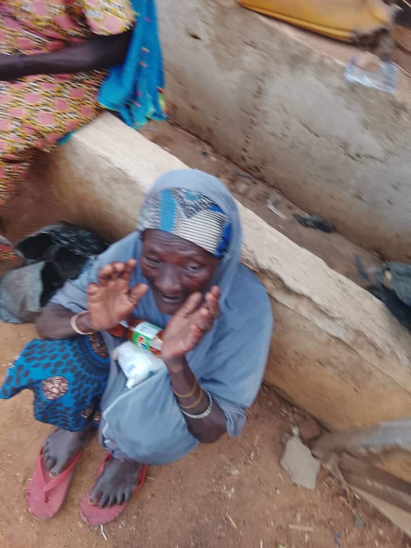 An elderly woman receiving support from the foundation.