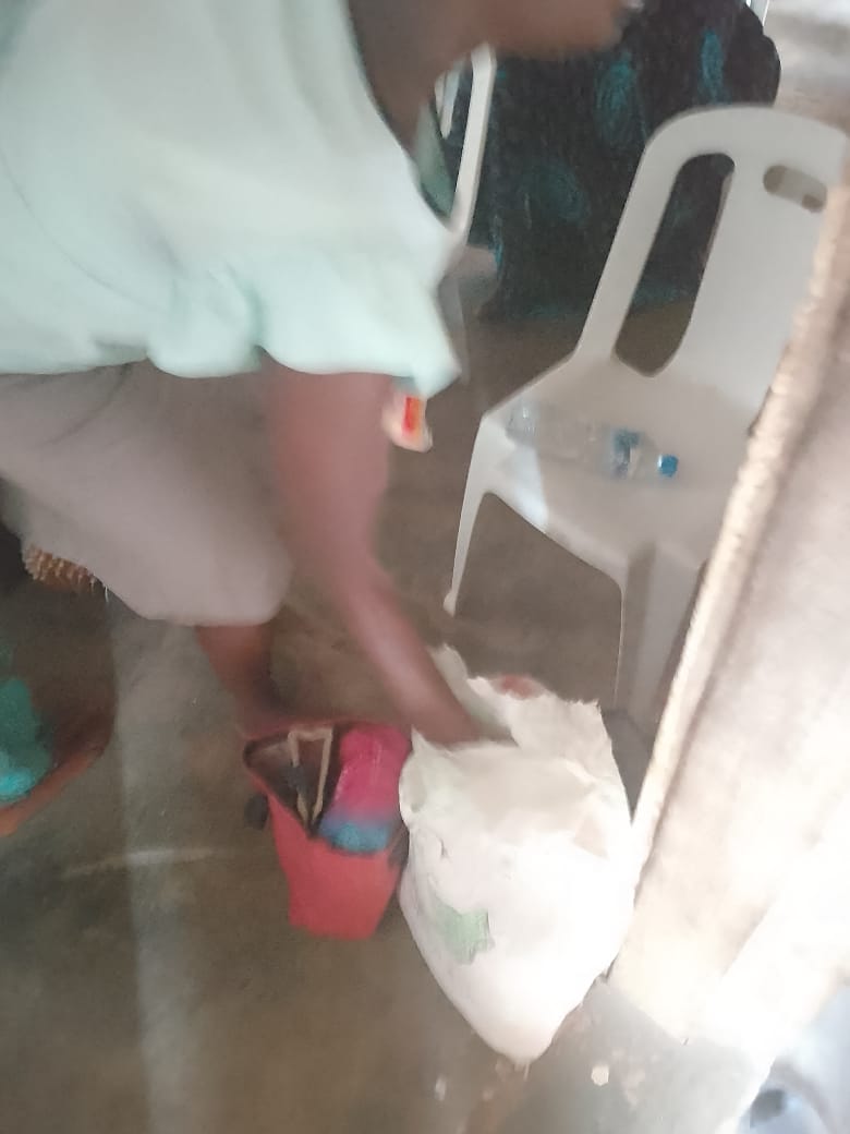 A caregiver during a home visit with supplies.